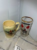 Ceramic mug and glass tumbler side by side