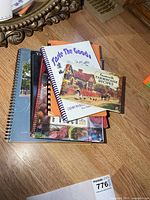 Stack of multiple cookbooks on table