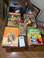 All five hardcover books laid out on table