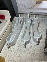 Top view showing all three white porcelain spooners on countertop