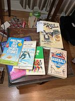 Overview of six sports books on table