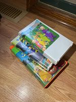 Stack of three Teletubbies VHS tapes