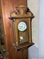 Front view of Forestville wall clock hanging on wall