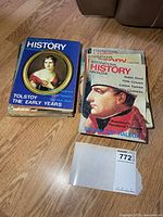 Two stacks of International History Magazine issues, main titles visible