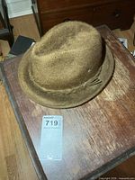 Top view of brown felt fedora showing crown shape and overall condition