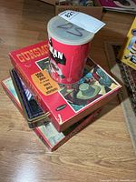 Stack of four vintage puzzles with Wolfman cylinder on top