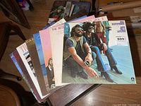 Stack of eight vinyl albums on table