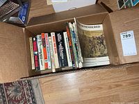 Full box view showing all books standing and War Remembered booklet