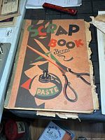 Scrapbook closed showing illustrated cover