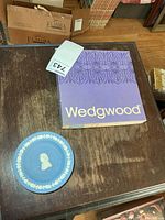 Blue jasperware dish and purple Wedgwood box on table