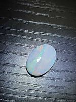 Front view of oval Ethiopian opal showing play-of-color