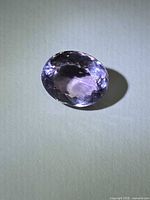 Oval faceted purple-pink amethyst front view