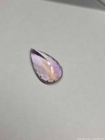 Front view of pear-cut Ametrine showing bi-colour zoning