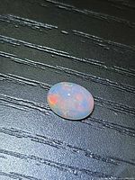 Top view of oval Ethiopian fire opal showing play-of-color