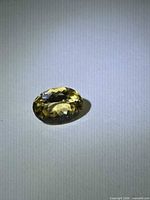 Oblique view of oval golden heliodor showing facet pattern and color