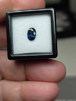 Front view oval sapphire in display box