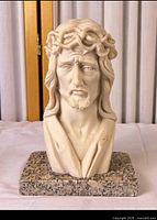 Front view of ivory Jesus Christ bust on granite base