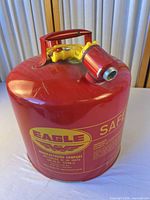 Full view of red Eagle safety can showing handle, spout, overall condition