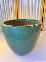 Overall view of green glazed planter
