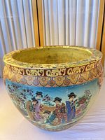 Full view of planter showing overall shape, exterior artwork and rim detail