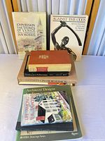 Group shot showing all books upright and stacked