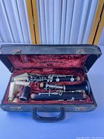 Clarinet pieces, mouthpiece, reed boxes and case interior