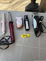 All five grooming tools laid out on table