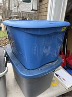 Blue tote stacked on grey tote showing overall appearance and lids