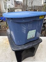 Blue Type A tote stacked on black tote, both with lids