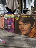 All three LP covers on table