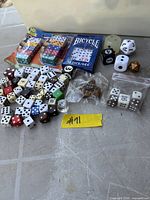 Overview of entire lot showing sealed packs, loose dice, mini dice bags