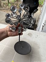 Front view showing starburst head with crystal accents and stand