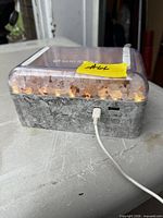 Front view of Lomi night light showing salt crystals, controls and USB cable