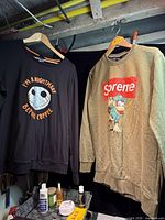 Both sweatshirts hanging to show full view