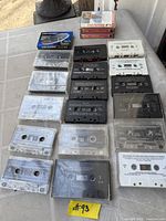 Overview of table showing majority of loose cassettes arranged in rows