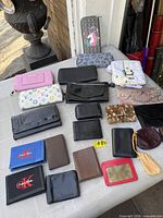 Overall view of all wallets laid out on table