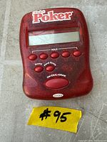 Front view of Radica Pocket Poker handheld game showing screen and control buttons