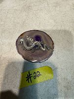 Top view showing entire pewter dragon on polished agate slice