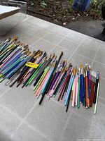 Wide view of entire spread of paint brushes