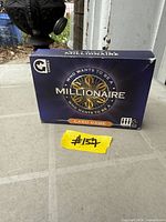 Front view of boxed Who Wants to Be a Millionaire card game