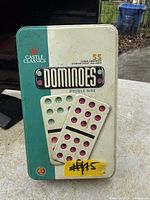 Closed Castle Classics domino tin showing branding and Double Nine reference