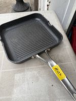 Top view of Heritage square grill pan showing ridged surface and handle