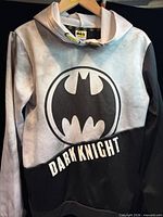 Front view of Batman Dark Knight hoodie on hanger
