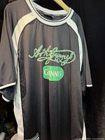 Front view of Guinness men's jersey showing graphics, color scheme and size