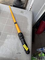 Lightsaber fully extended on table showing full length