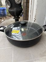 Pan with lid on showing overall appearance and dual handles