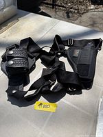 Full view of holster harness and magazine pouch laid out on table