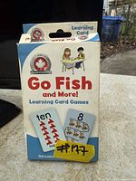 Front of box displaying title, illustrations and sample cards