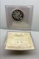 Coin in sealed holder with grade and cert number visible