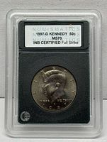 Obverse of 1997-D Kennedy half dollar in INB slab showing grade label